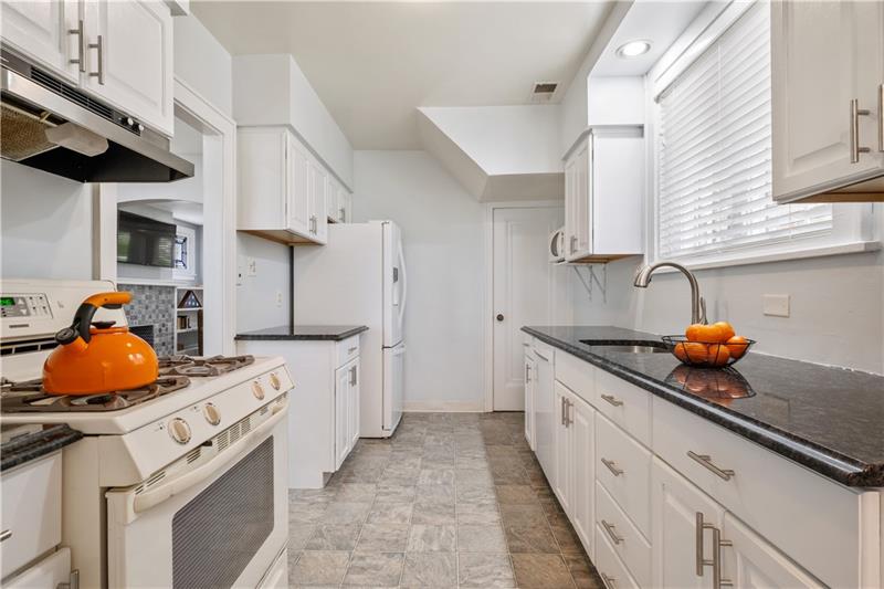 490 Mapleton Avenue Pittsburgh, PA 15228 - Photo 13 of 35 a kitchen with stainless steel appliances a sink a stove and cabinets