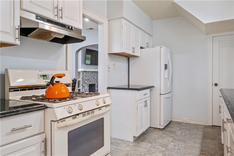 490 Mapleton Avenue Pittsburgh, PA 15228 - Photo 14 of 35 a kitchen with stainless steel appliances granite countertop a stove and a refrigerator