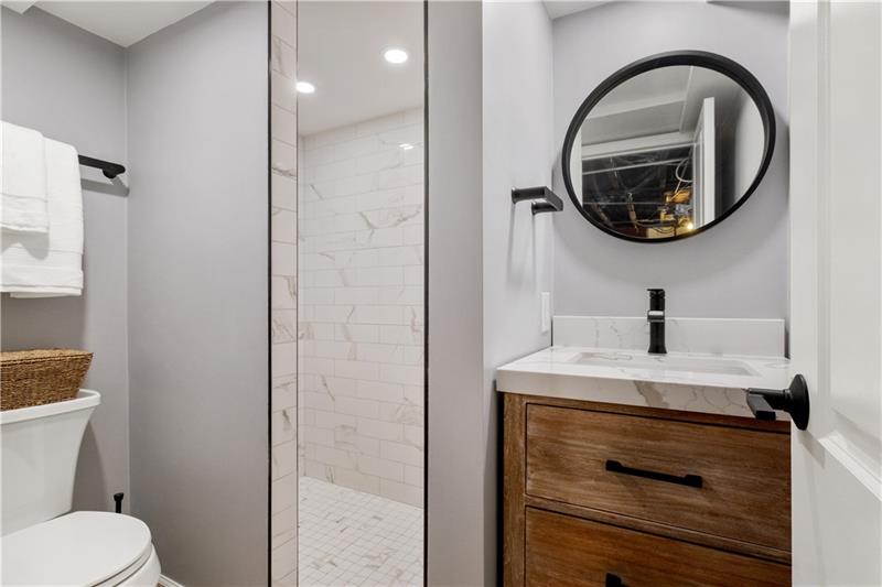 490 Mapleton Avenue Pittsburgh, PA 15228 - Photo 18 of 35 a bathroom with a sink and a mirror