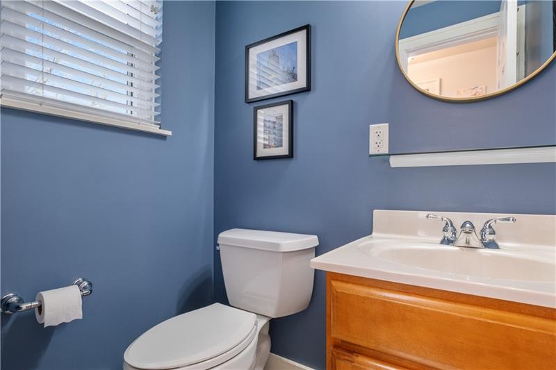 490 Mapleton Avenue Pittsburgh, PA 15228 - Photo 26 of 35 a bathroom with a toilet a sink and mirror