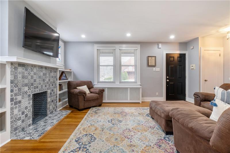 490 Mapleton Avenue Pittsburgh, PA 15228 - Photo 6 of 35 a living room with furniture window and a fireplace