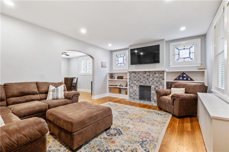 490 Mapleton Avenue Pittsburgh, PA 15228 - Photo 7 of 35 a living room with furniture or flat screen tv and a fireplace
