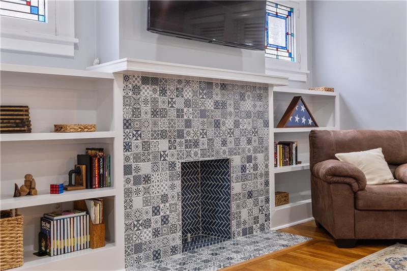 490 Mapleton Avenue Pittsburgh, PA 15228 - Photo 10 of 35 a living room with fireplace furniture and a wooden floor