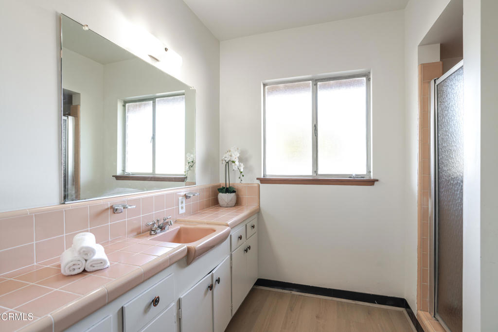1504 East Grovecenter Street Covina, CA 91724 - Photo 12 of 17 a bathroom with a sink and a window