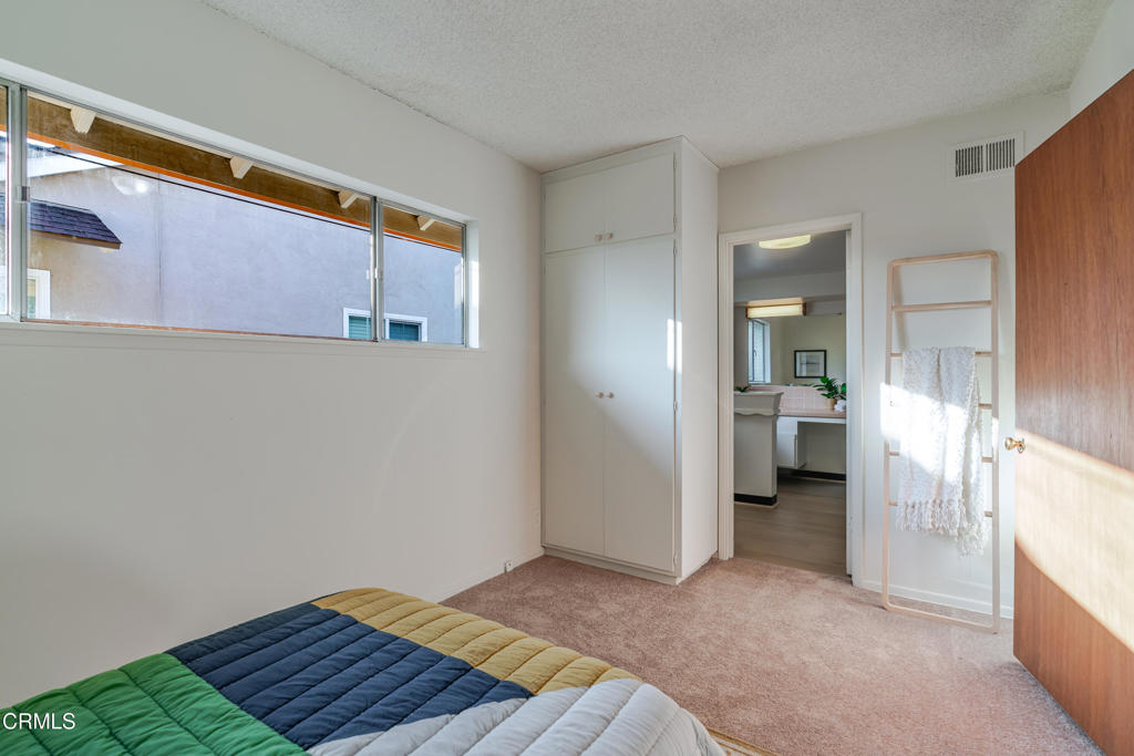 1504 East Grovecenter Street Covina, CA 91724 - Photo 13 of 17 a view of a bedroom with a bed and a bathroom