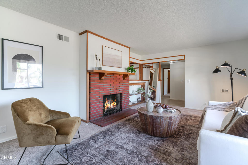 1504 East Grovecenter Street Covina, CA 91724 - Photo 3 of 17 a living room with furniture and a fireplace