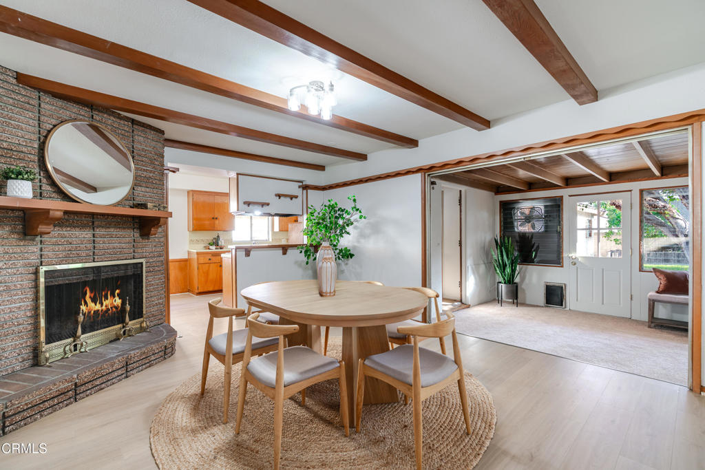 1504 East Grovecenter Street Covina, CA 91724 - Photo 5 of 17 a dining room with furniture and a fireplace