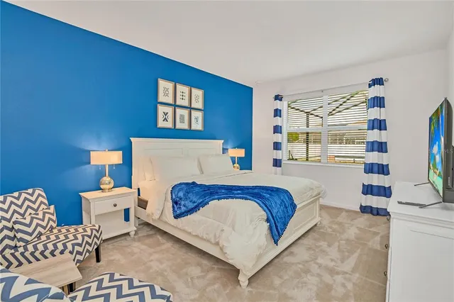 a bedroom with a bed and a cabinets