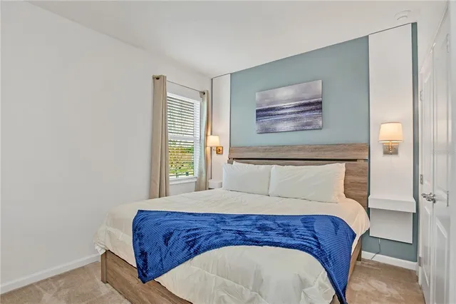 a room with a bed and window