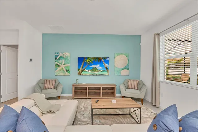 a living room with furniture and a window