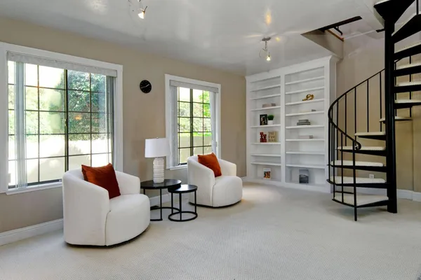 a living room with furniture a fireplace and a chandelier