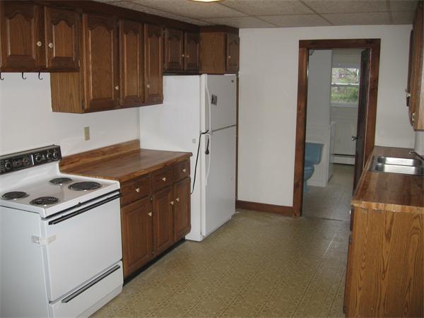 68 Fitchburg Road Townsend, MA 01469 - Photo 3 of 17 a kitchen with stainless steel appliances granite countertop a stove and a refrigerator