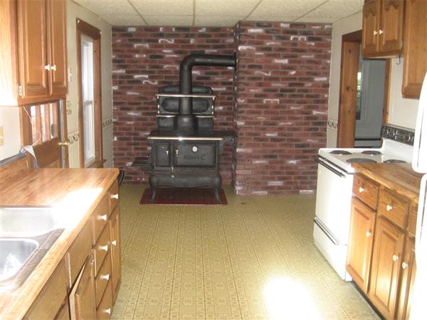 68 Fitchburg Road Townsend, MA 01469 - Photo 6 of 17 a bathroom with a granite countertop sink a vanity and shower