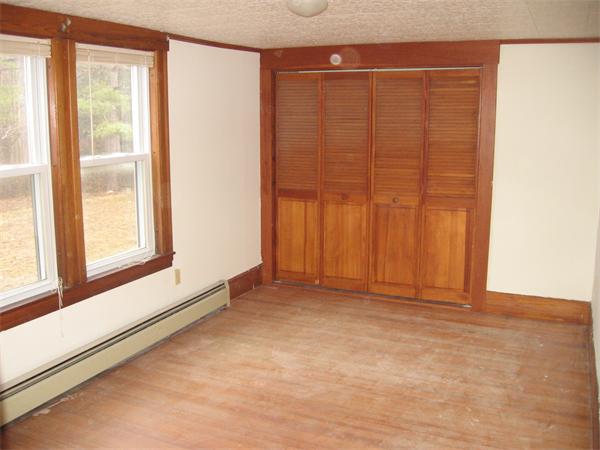 68 Fitchburg Road Townsend, MA 01469 - Photo 9 of 17 an empty room with windows