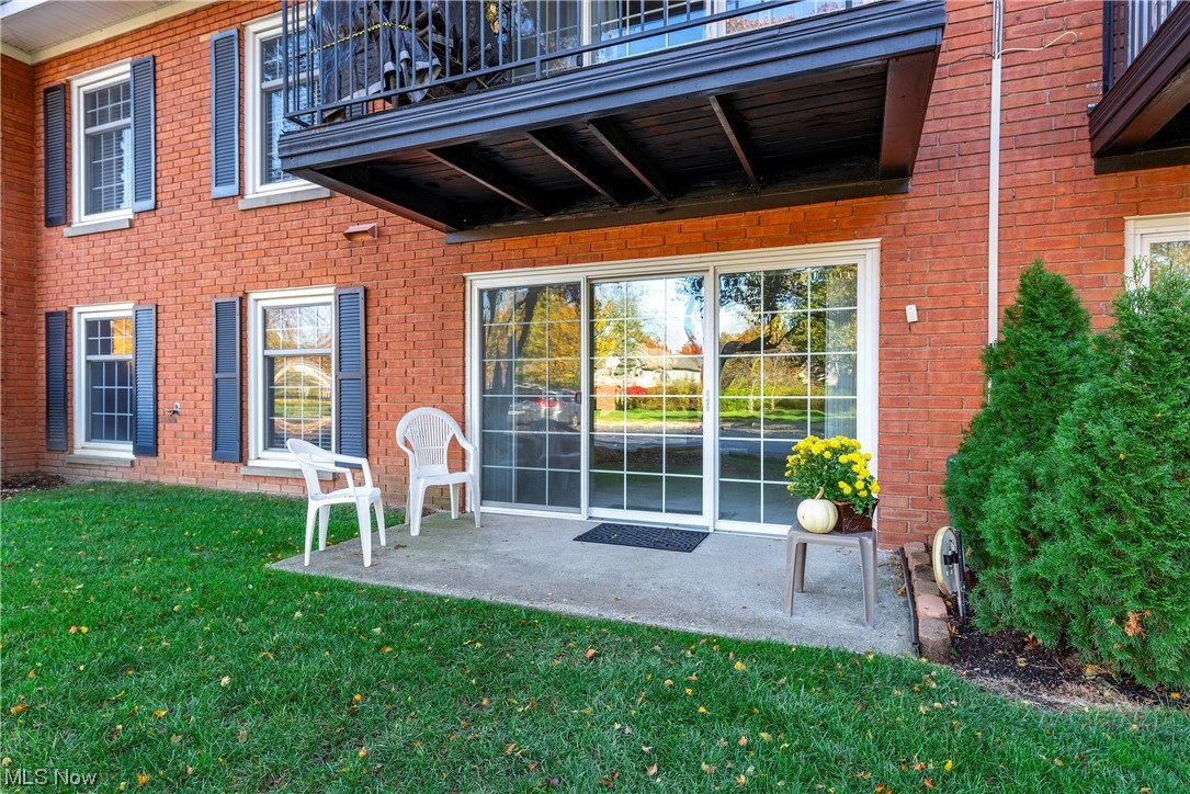 22701 Center Ridge Road, Unit 113 Rocky River, OH 44116 - Photo 9 of 29 Spacious patio with newer sliders, green space & trees
