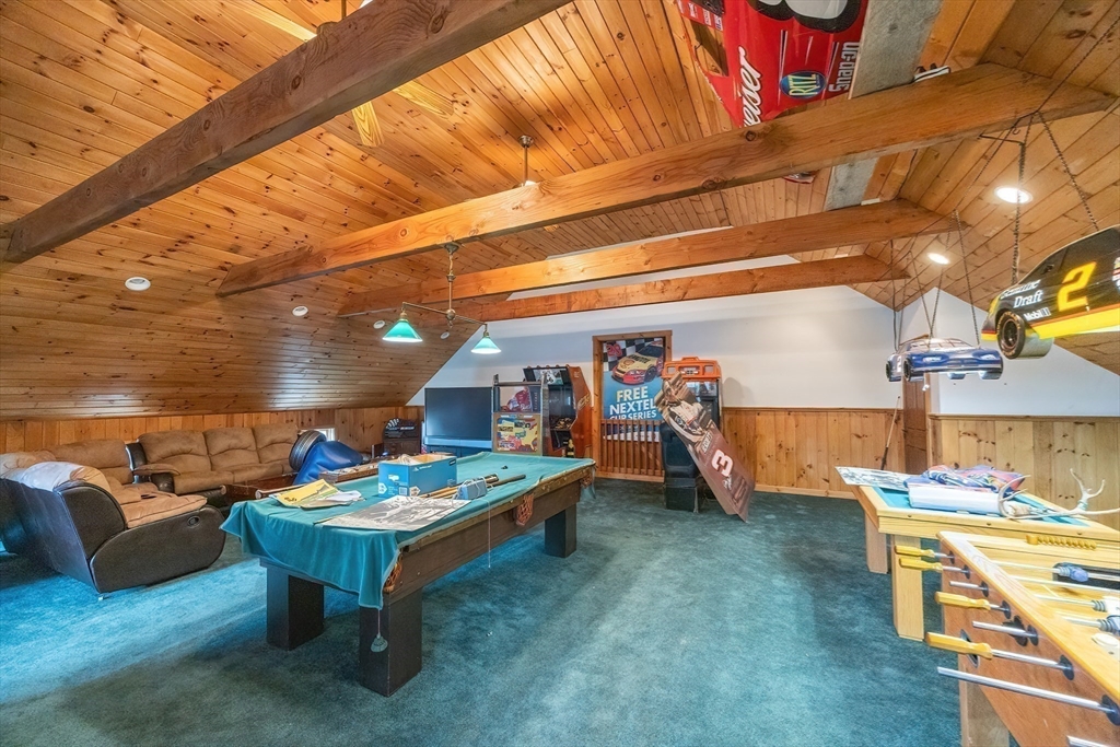 9 Abigail Drive Hudson, MA 01749 - Photo 25 of 36 a outdoor space with the couches and dining table under an umbrella