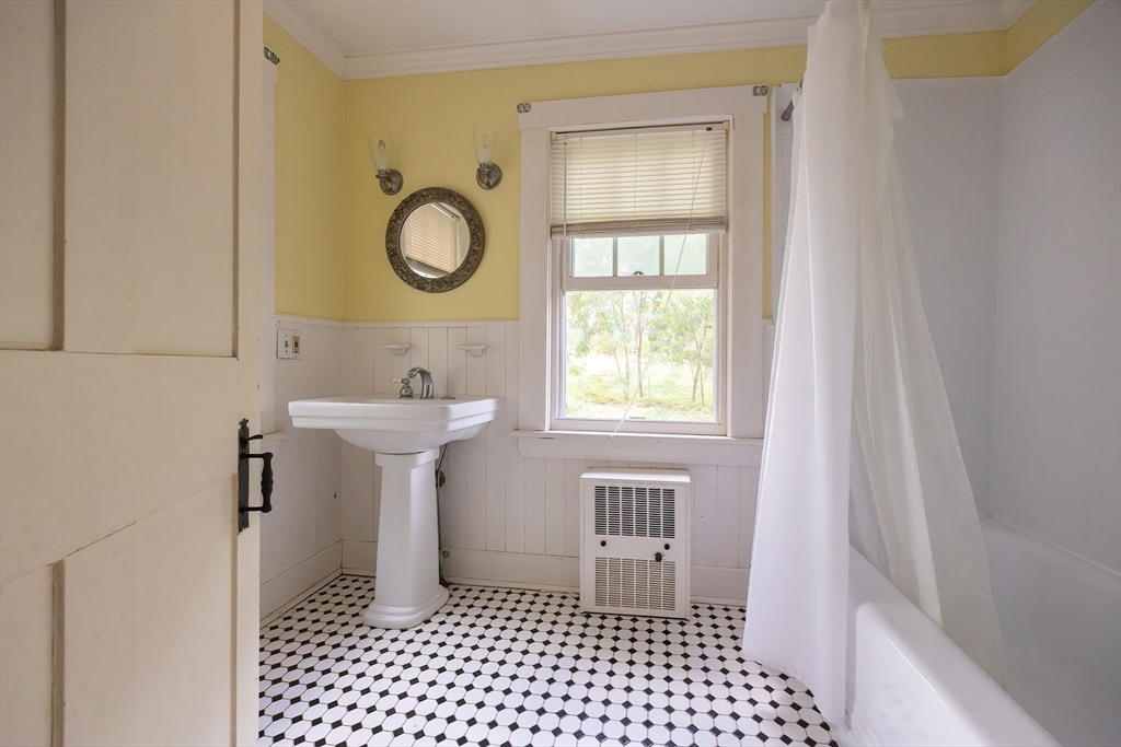 9 Abigail Drive Hudson, MA 01749 - Photo 35 of 36 a bathroom with a sink a toilet and a window