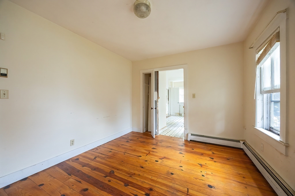 9 Abigail Drive Hudson, MA 01749 - Photo 36 of 36 a view of empty room with wooden floor and fan