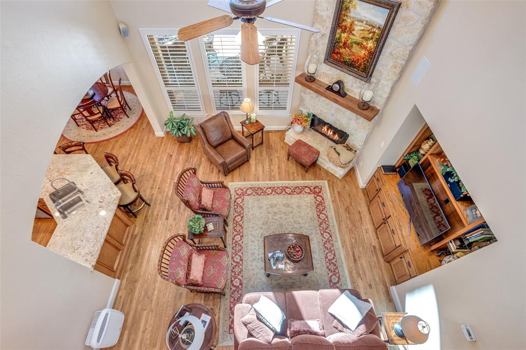 1109 Canton Court Allen, TX 75013 - Photo 14 of 40 view of living room with furniture and a floor to ceiling window