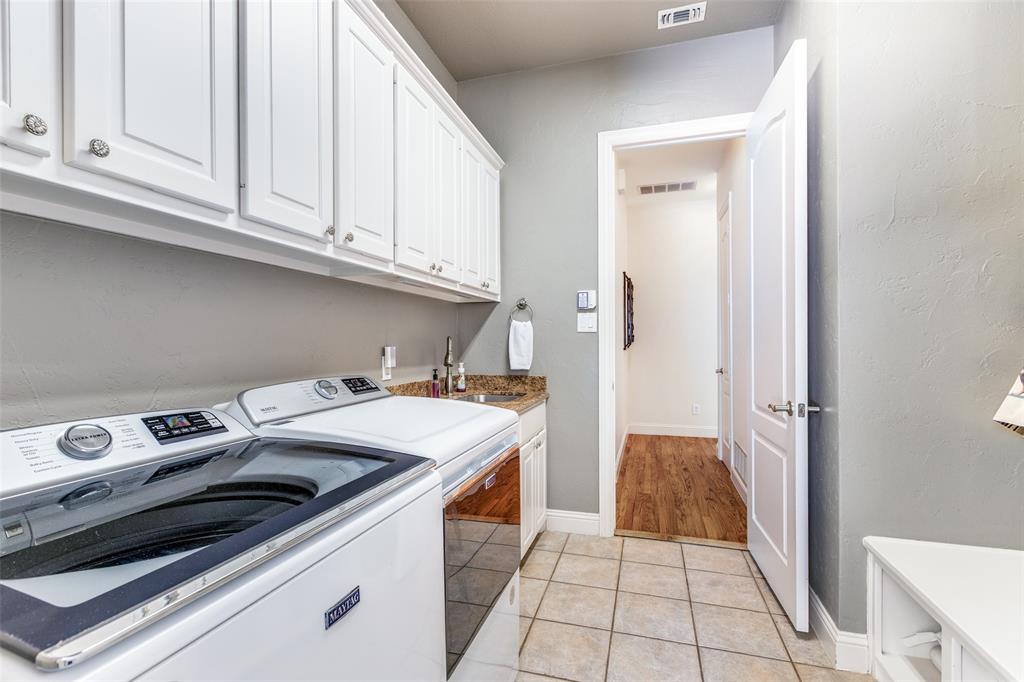 1109 Canton Court Allen, TX 75013 - Photo 18 of 40 a utility room with dryer and washer