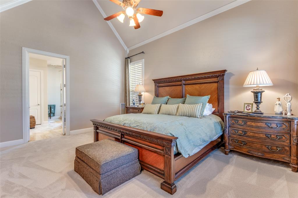 1109 Canton Court Allen, TX 75013 - Photo 22 of 40 a bedroom with a bed and a chandelier
