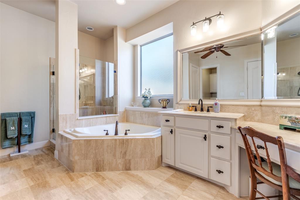 1109 Canton Court Allen, TX 75013 - Photo 24 of 40 a bathroom with a tub a double vanity sink and mirror