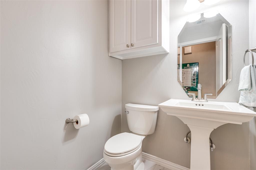 1109 Canton Court Allen, TX 75013 - Photo 27 of 40 a bathroom with a toilet sink and mirror