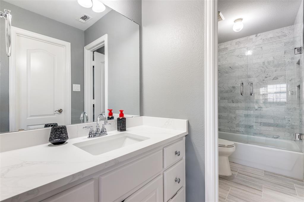 1109 Canton Court Allen, TX 75013 - Photo 30 of 40 a bathroom with a sink and a mirror