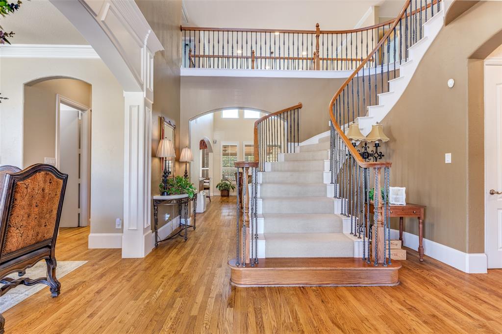 1109 Canton Court Allen, TX 75013 - Photo 3 of 40 a view of entryway and hall with wooden floor