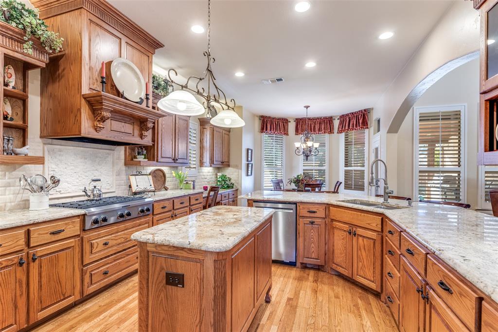 1109 Canton Court Allen, TX 75013 - Photo 10 of 40 a kitchen with lots of counter space and a sink