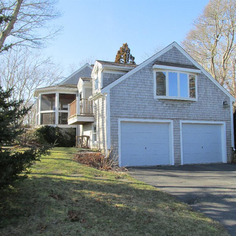 3 Plow Penny Road Bourne, MA 02532 - Photo 3 of 35 a front view of a house with a yard