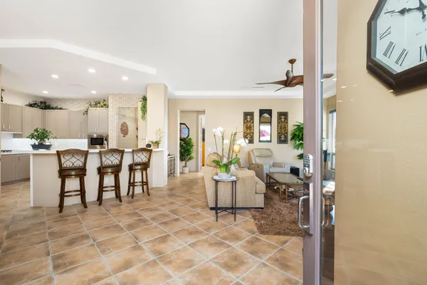 a living room with furniture a dining table and chairs