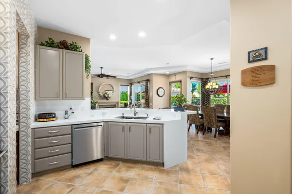 a kitchen with a sink and cabinets
