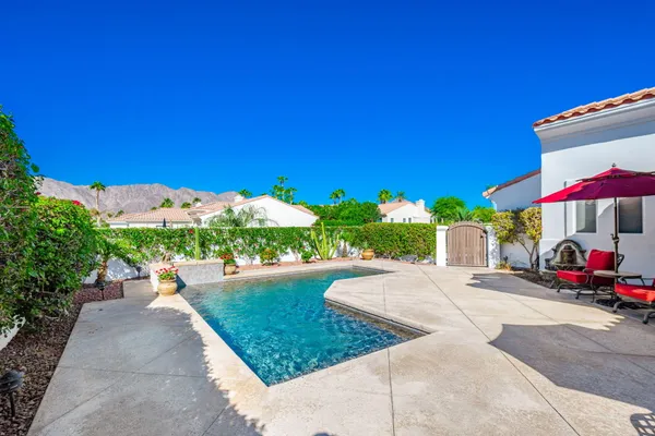 a view of a street with cars parked