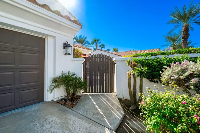 a couple of potted plants in front of door
