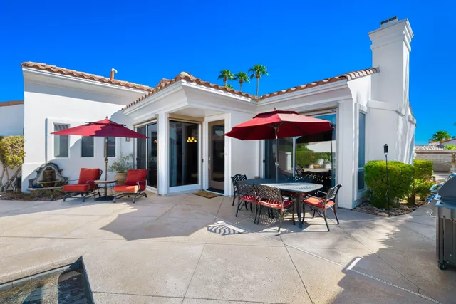 a view of a chairs and tables in patio of the house