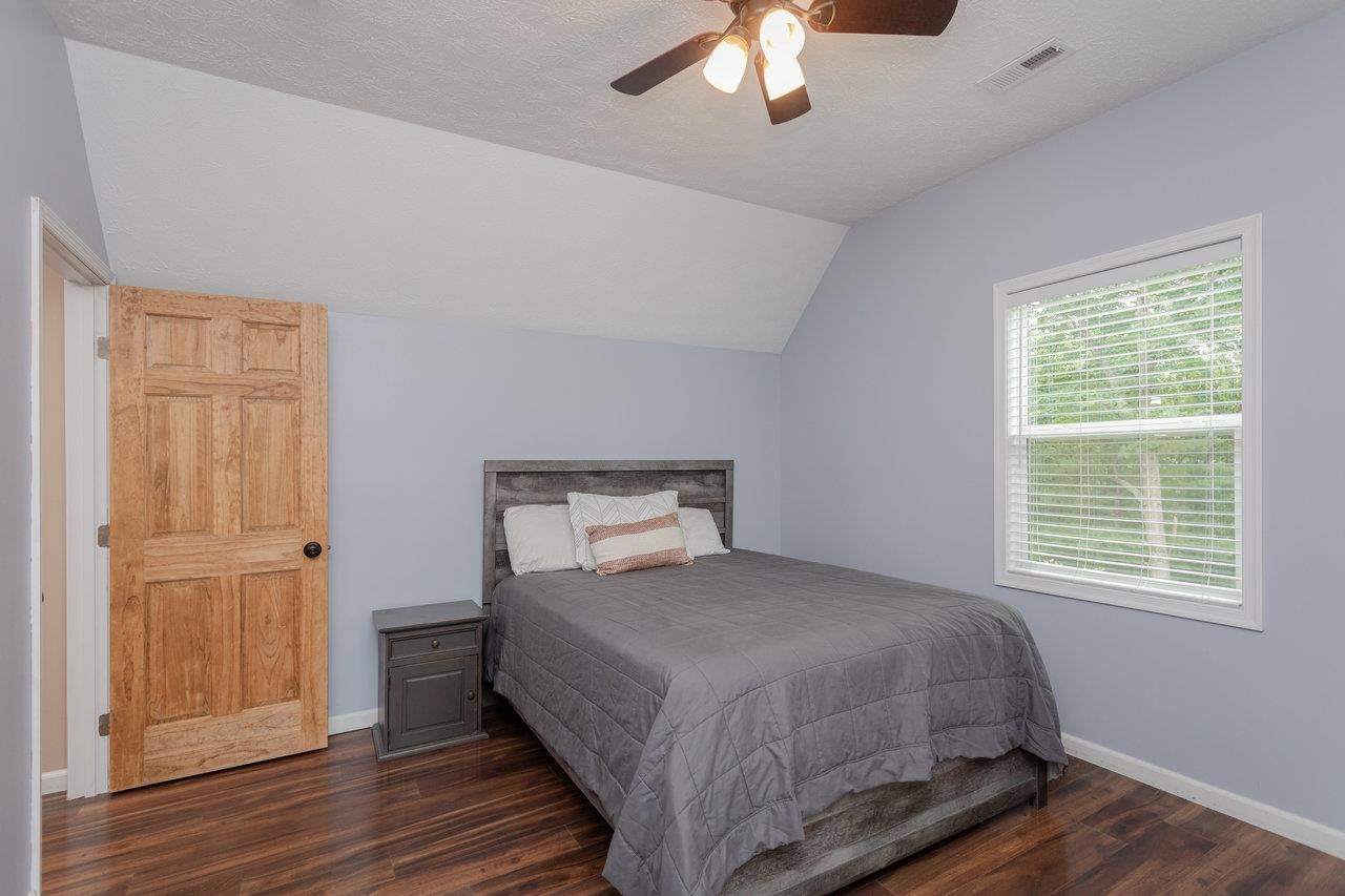 159 Park View Shenandoah, VA 22849 - Photo 37 of 70 a bedroom with a bed and a chandelier