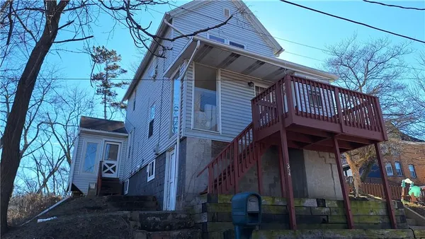 a view of a house with a roof deck