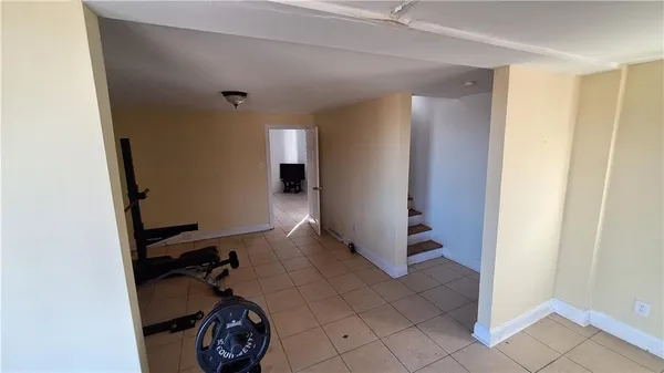 a view of a storage & utility room with closet dryer