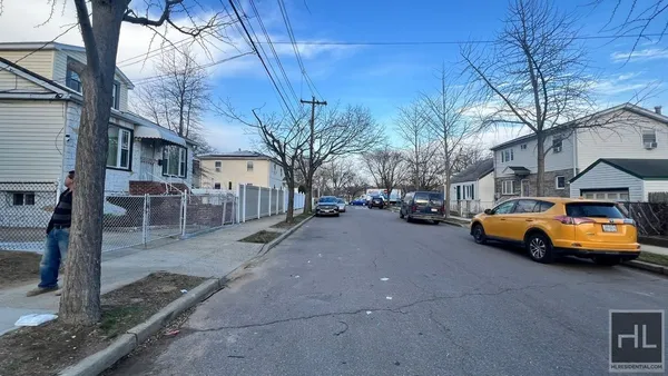 a view of street with parked cars