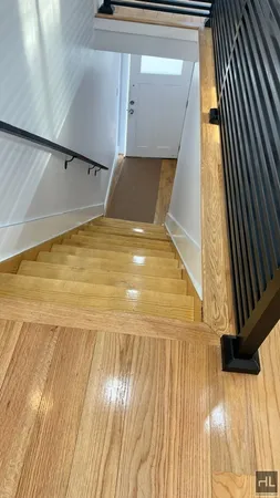 a view of balcony with wooden floor