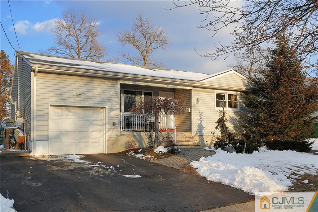 15 Ferris Road Edison, NJ 08817 - Photo 1 of 24 a front view of a house with garden