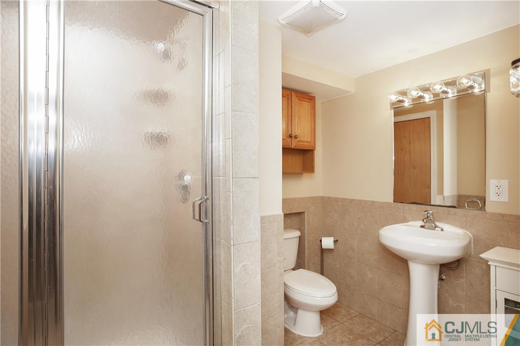 15 Ferris Road Edison, NJ 08817 - Photo 20 of 24 a bathroom with a sink toilet and shower
