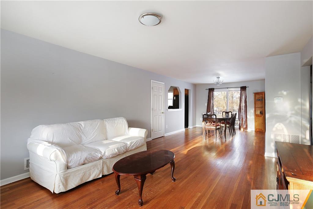 15 Ferris Road Edison, NJ 08817 - Photo 3 of 24 a living room with furniture and wooden floor
