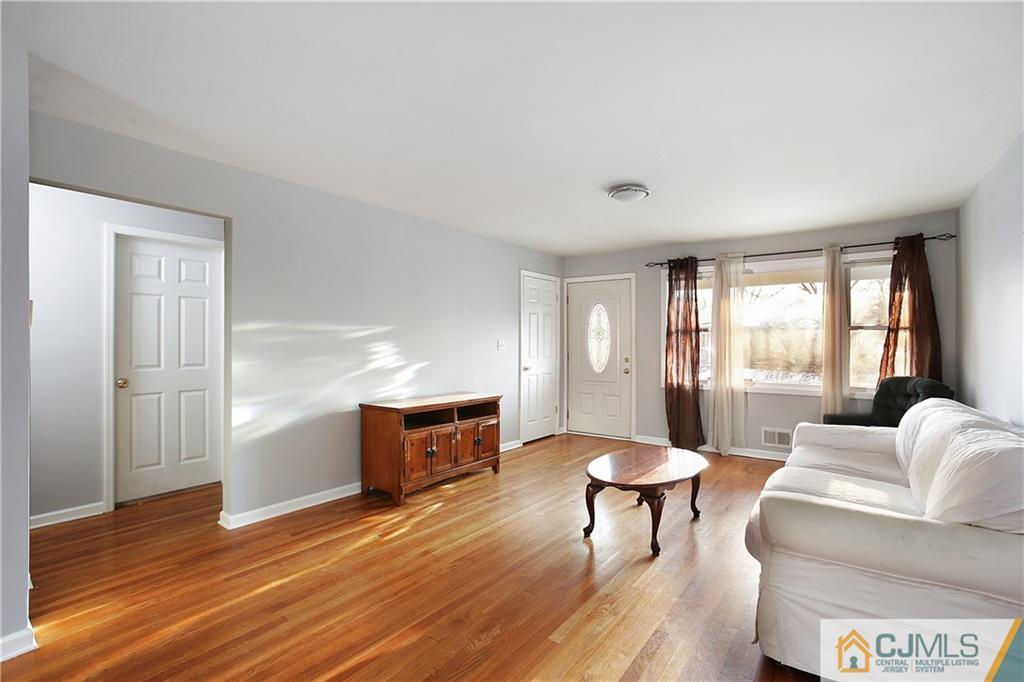 15 Ferris Road Edison, NJ 08817 - Photo 4 of 24 a living room with furniture and a large window