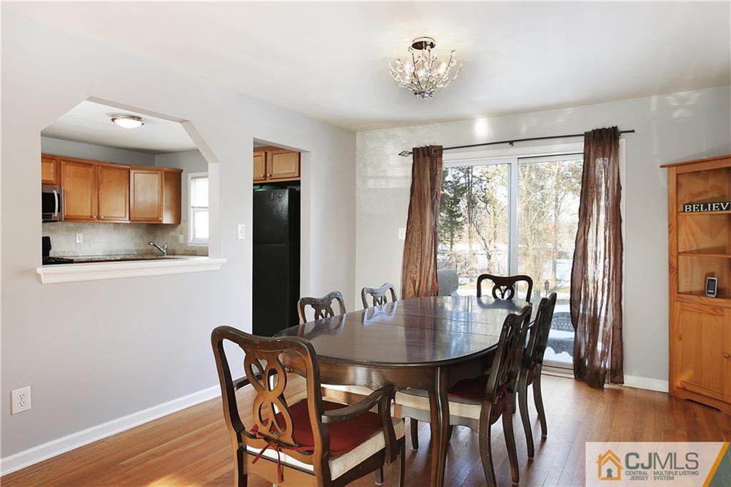 15 Ferris Road Edison, NJ 08817 - Photo 5 of 24 a view of a dining room with furniture window and wooden floor