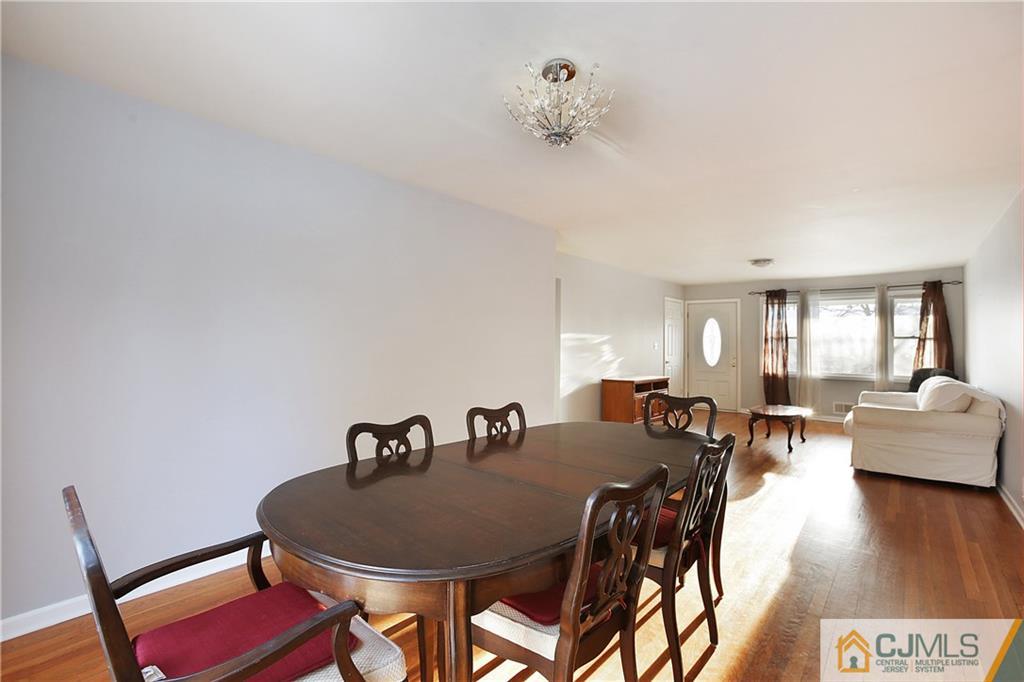15 Ferris Road Edison, NJ 08817 - Photo 6 of 24 a view of a dining room with furniture and wooden floor
