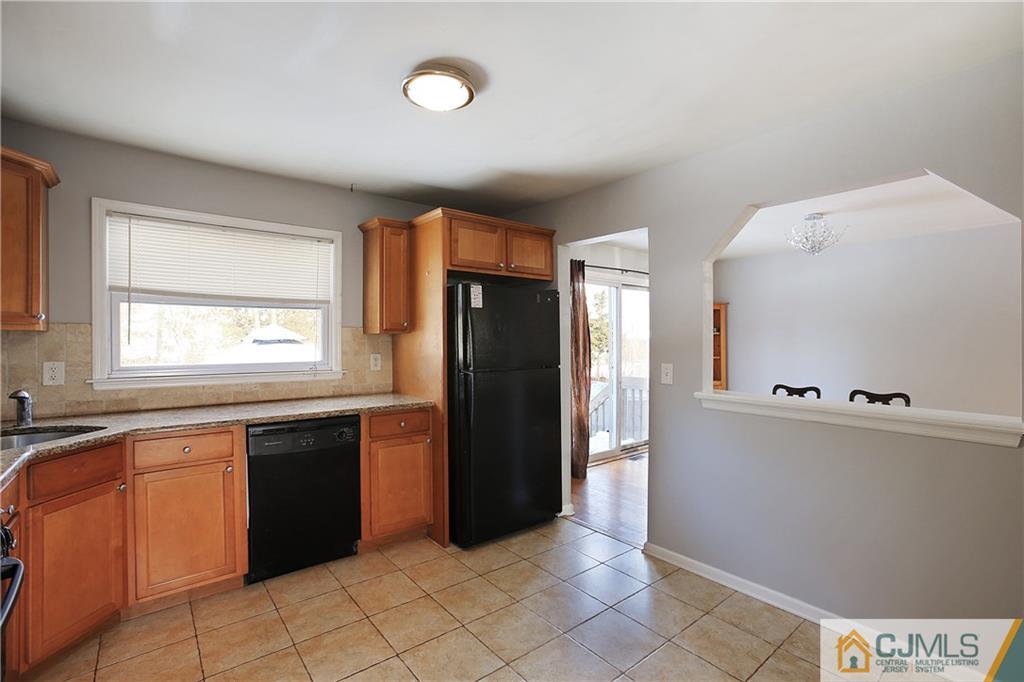 15 Ferris Road Edison, NJ 08817 - Photo 7 of 24 a kitchen with stainless steel appliances granite countertop a refrigerator and a sink