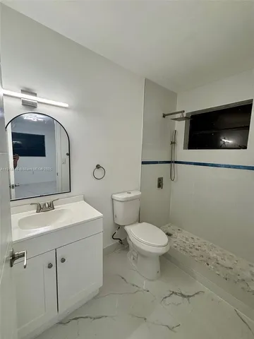 a porch with table and chairs