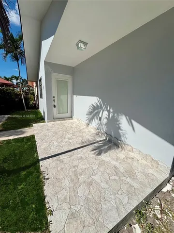 a bedroom with a bed and a stove